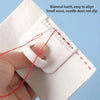 A hand is using a white sewing guide template with red thread to align and stitch two teeth.