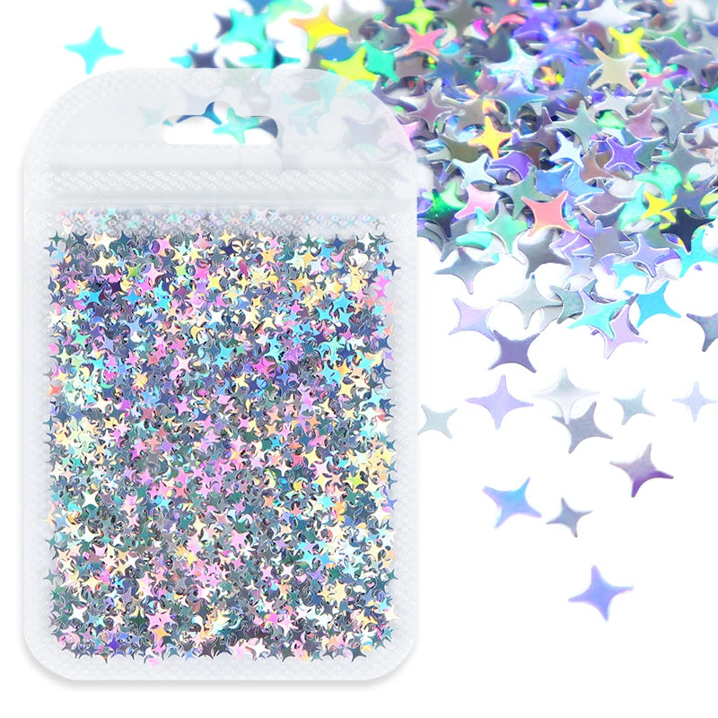 A clear plastic bag filled with shiny holographic star sequins and loose sequins scattered nearby.