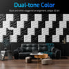 Black and white staggered diamond textured wall panels used as modern accent wall decor.