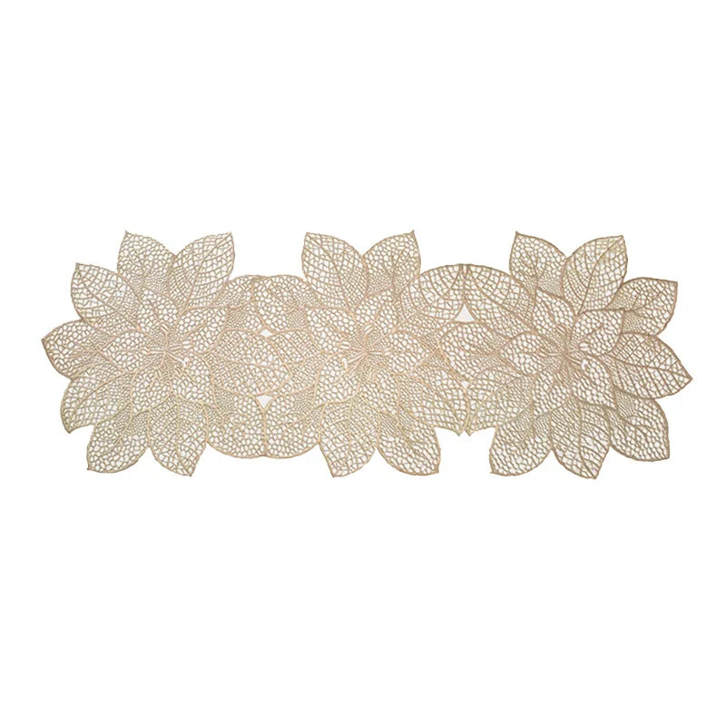 A set of ornate PVC table runners and placemats featuring a delicate floral lace design in a beige color.