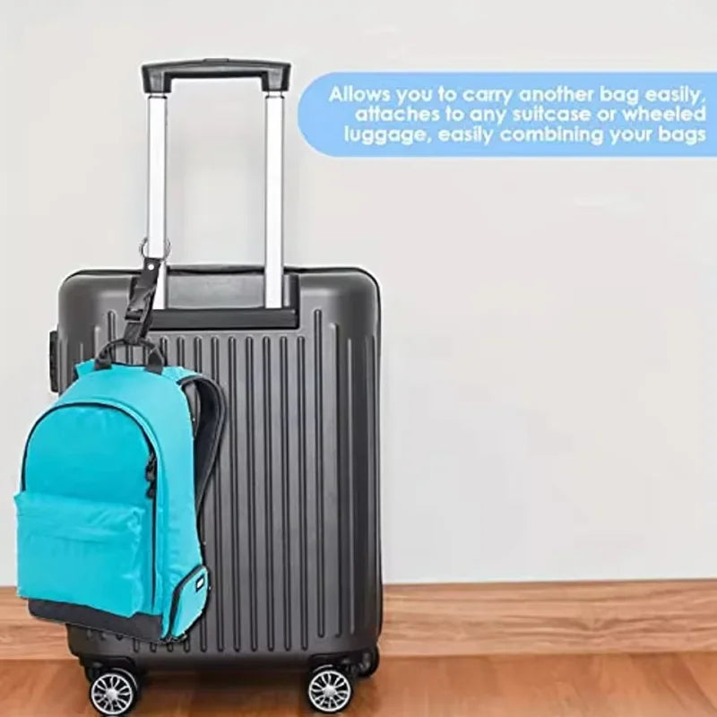 A black rolling suitcase with a bright blue backpack attached by an adjustable hanging strap.