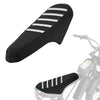 Black motorcycle seat cover with white anti-slip stripes installed on a motorcycle seat.