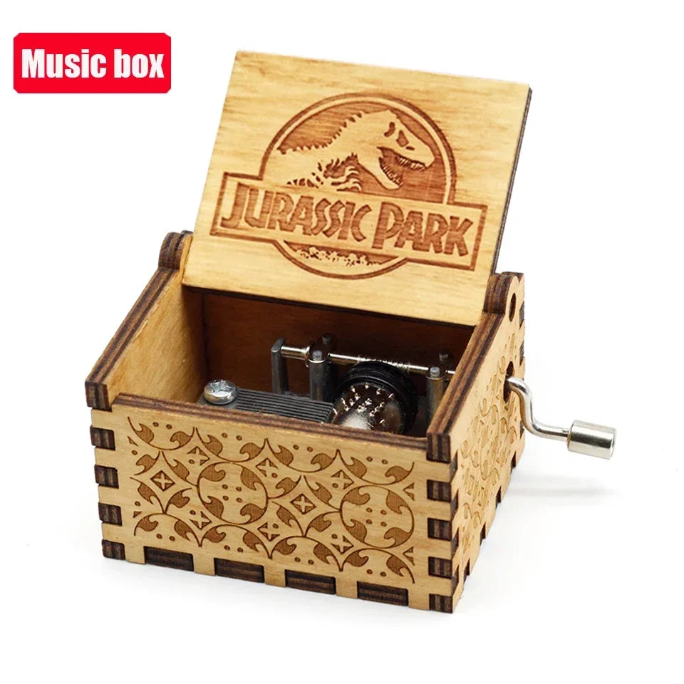 A wooden music box with a Jurassic Park theme featuring an engraved lid and decorative paneling.
