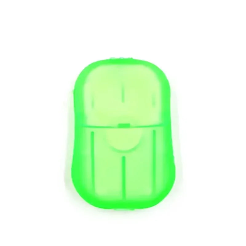 A single lime green portable disposable soap tablet for travel.