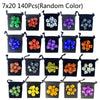 A set of 7 random colored polyhedral dice stored in individual black fabric bags.