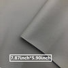 A close-up of a gray leather repair patch with a stitched edge, showing its dimensions 7.87 inches by 5.90 inches.