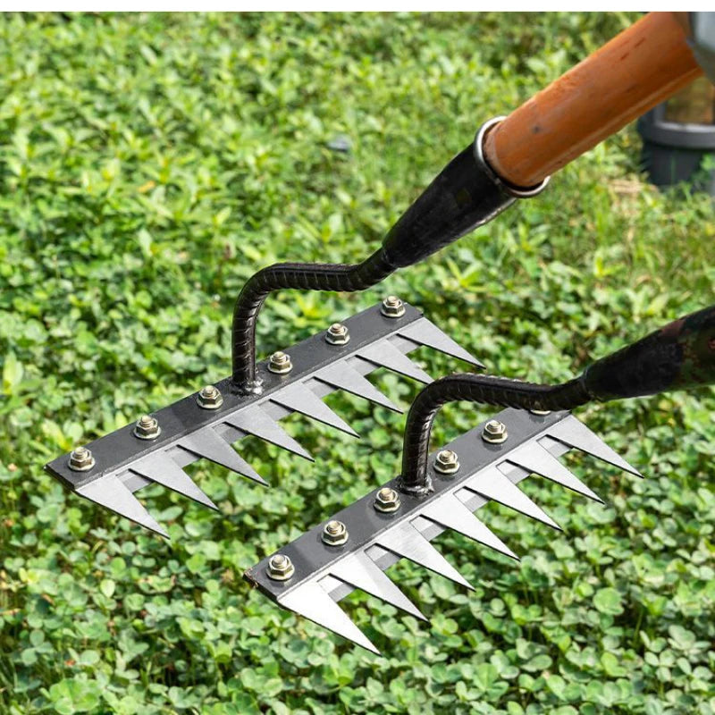 A pair of durable garden hand rakes with black metal tines and wooden handles resting on green grass.