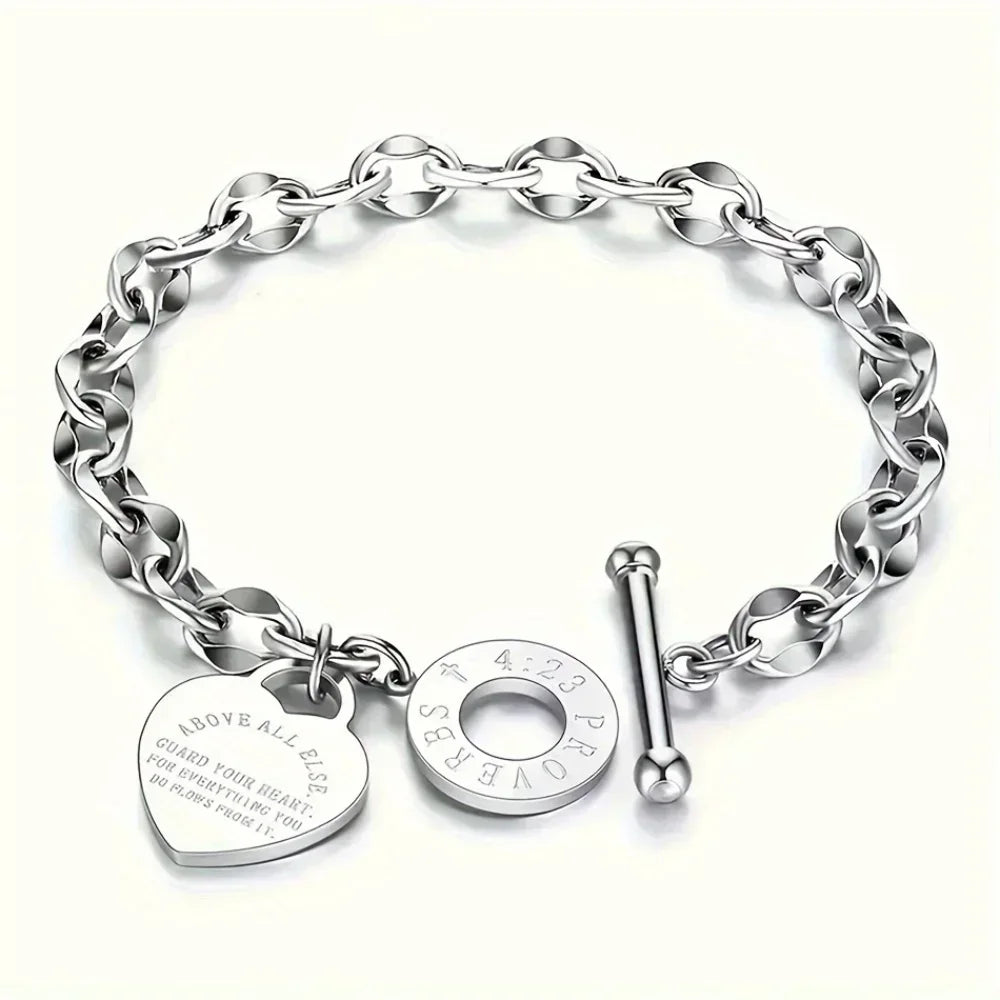 A silver stainless steel double heart pendant bracelet with a chain link design.