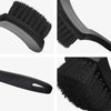 A set of black heavy-duty tire and wheel cleaning brushes shown from various angles.