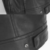 Close-up view of a black faux leather biker vest with stitching and a snap button detail.