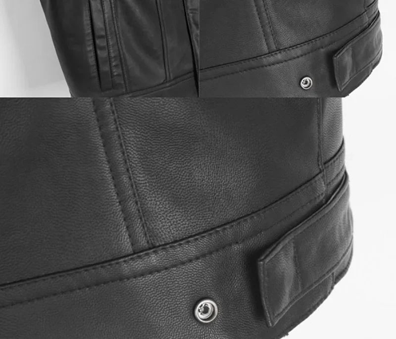 Close-up view of a black faux leather biker vest with stitching and a snap button detail.