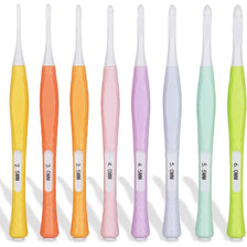 An array of eight ergonomic crochet hooks in various pastel colors and sizes ranging from 2.5mm to 6mm.