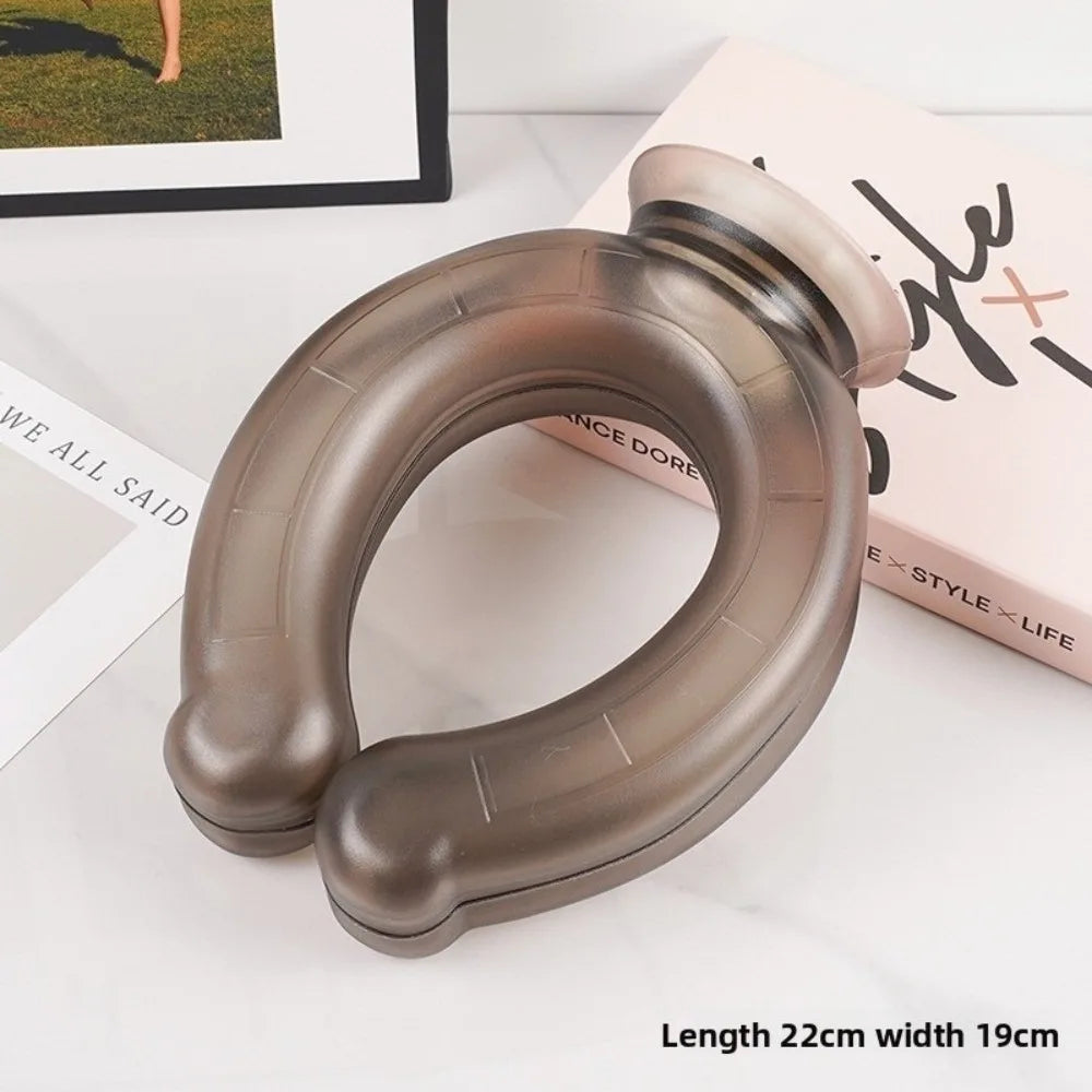 A brown U-shaped reusable neck wrap is shown on a white surface next to a book.