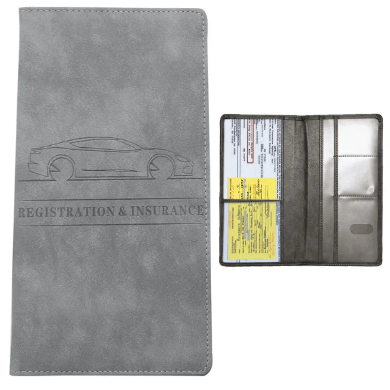 A gray leather slim card holder wallet for vehicle registration, license, and insurance cards.