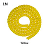 Yellow 1M cable protector sleeve coiled into a circular shape