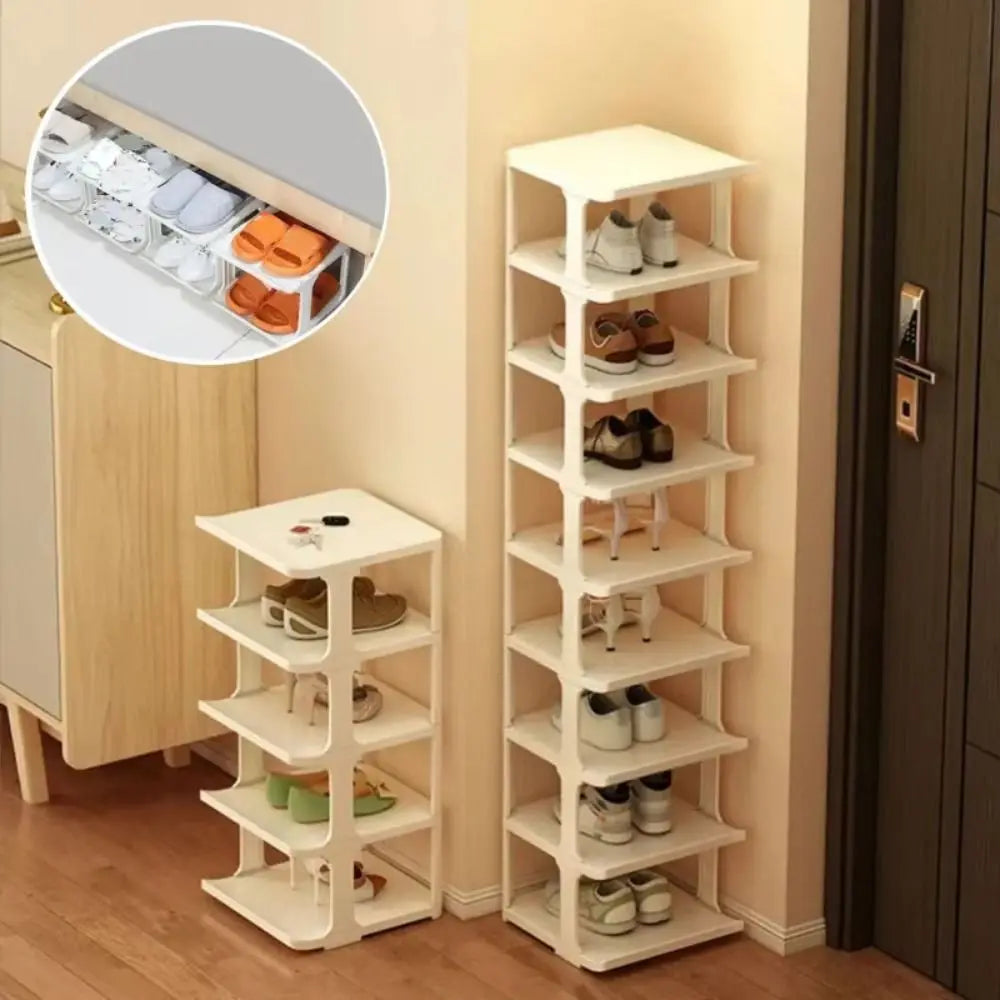 A white stackable vertical shoe rack with multiple tiers is shown next to a wooden cabinet.