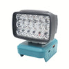 A portable LED work light with a black housing and multiple clear bulbs mounted on a teal base.