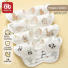 A pack of five white cotton muslin bandana bibs featuring cute panda and animal designs for babies