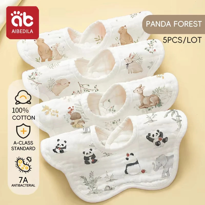 A pack of five white cotton muslin bandana bibs featuring cute panda and animal designs for babies
