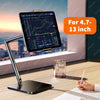 An adjustable metal tablet stand with a flexible arm holding a large tablet displaying a stock chart on a wooden desk.