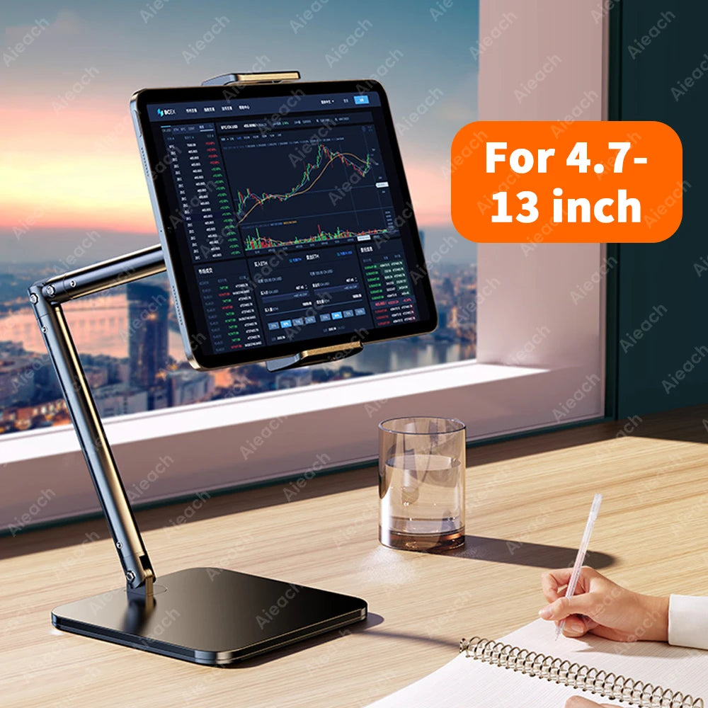 An adjustable metal tablet stand with a flexible arm holding a large tablet displaying a stock chart on a wooden desk.