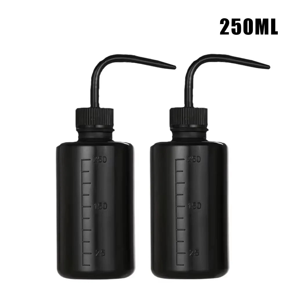 Two black tattoo squeeze bottles with precision tips and 250ml volume markings.
