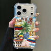 A hand holds a clear phone case featuring Colombian art, including flags, architecture, and tropical elements.