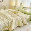 A light yellow breathable summer seersucker quilt spread on a bed with white bedding and a small white stuffed animal.