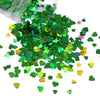 A pile of shiny holographic green heart-shaped sequins for resin crafts.
