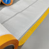 Roll of clear masking film with yellow edge used for painting protection.