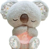A soft gray koala plush toy with closed eyes and light-colored ear accents.