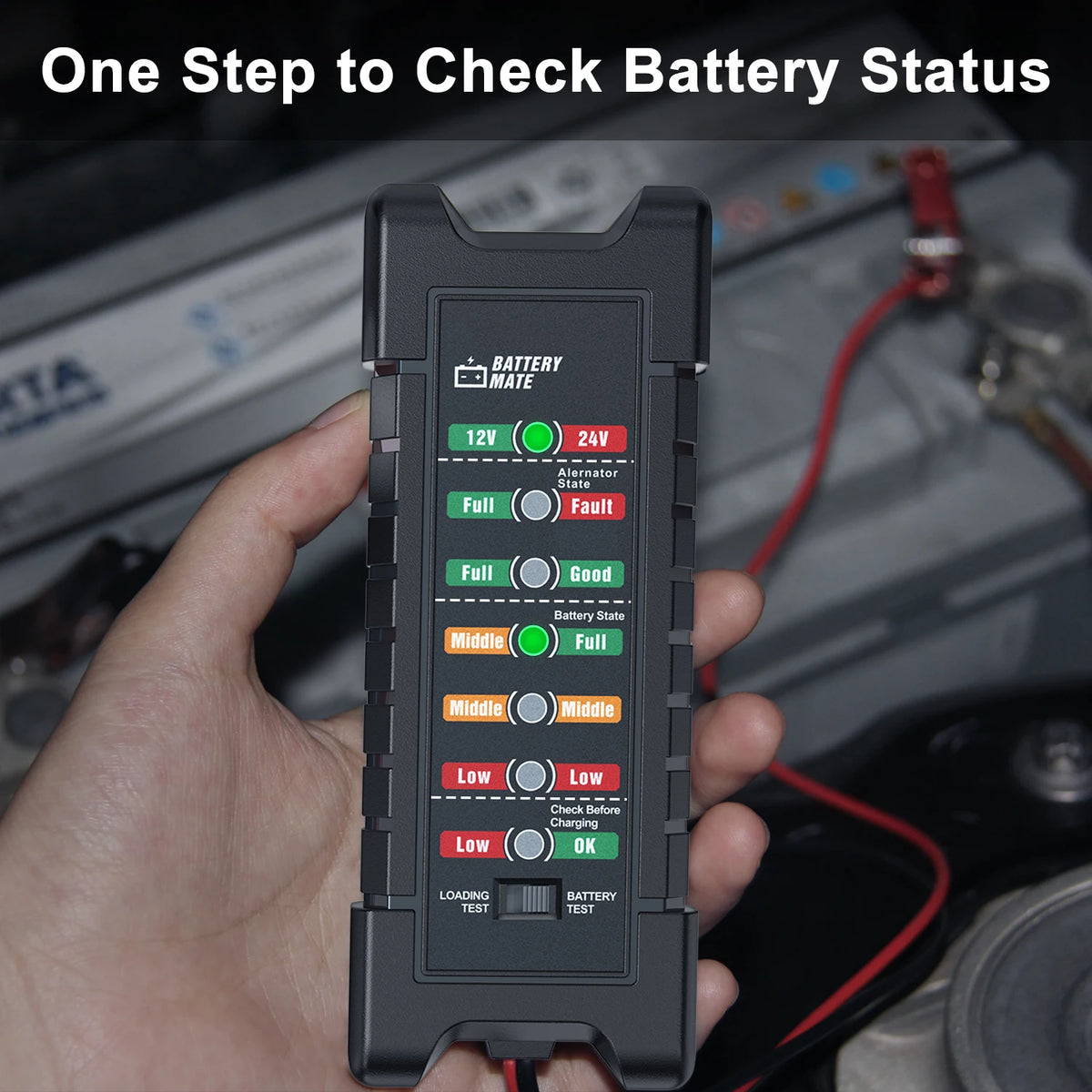 A hand holds a black car battery tester device displaying various LED indicators for battery status.