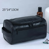 A black PU vintage luxury toiletry bag with a zippered compartment is shown on a white surface.