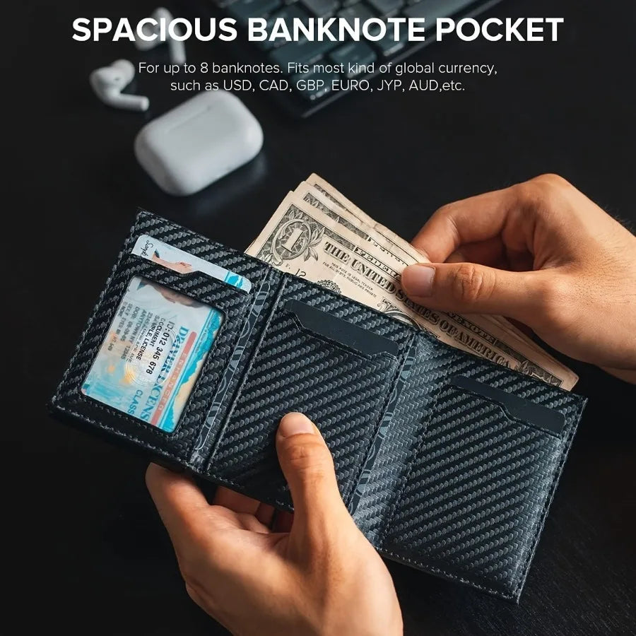 A hand holds a black slim pop-up wallet displaying US banknotes and various global currencies.