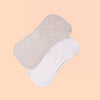 A pair of light beige and white multi-use baby burp cloths are shown on a plain background.
