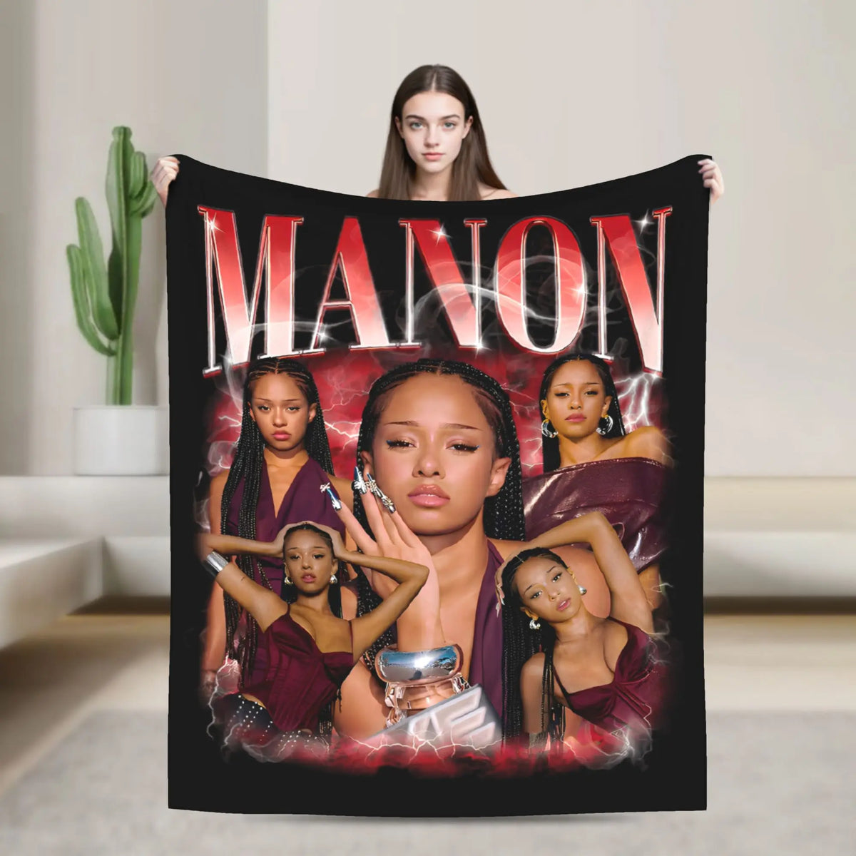 A dark graphic blanket featuring the name MANON and several women in various poses.