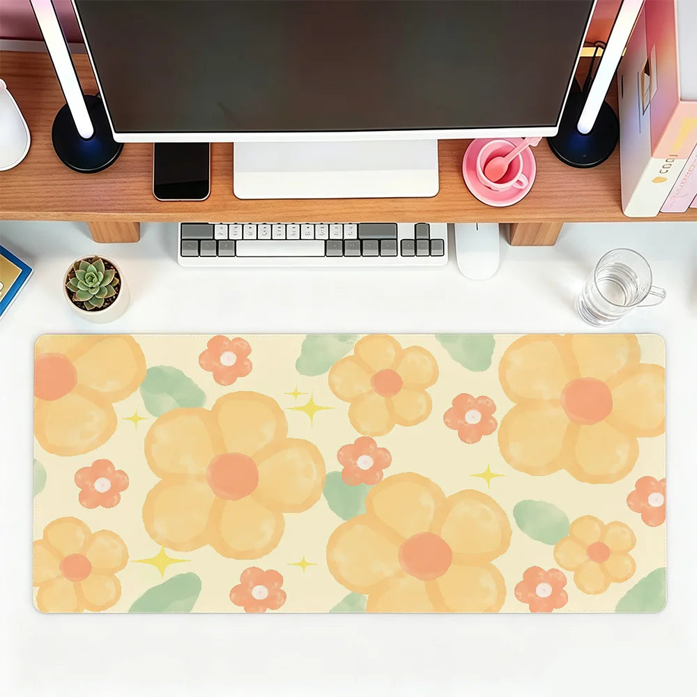 A beige floral mouse pad featuring yellow and orange flowers on a white background.