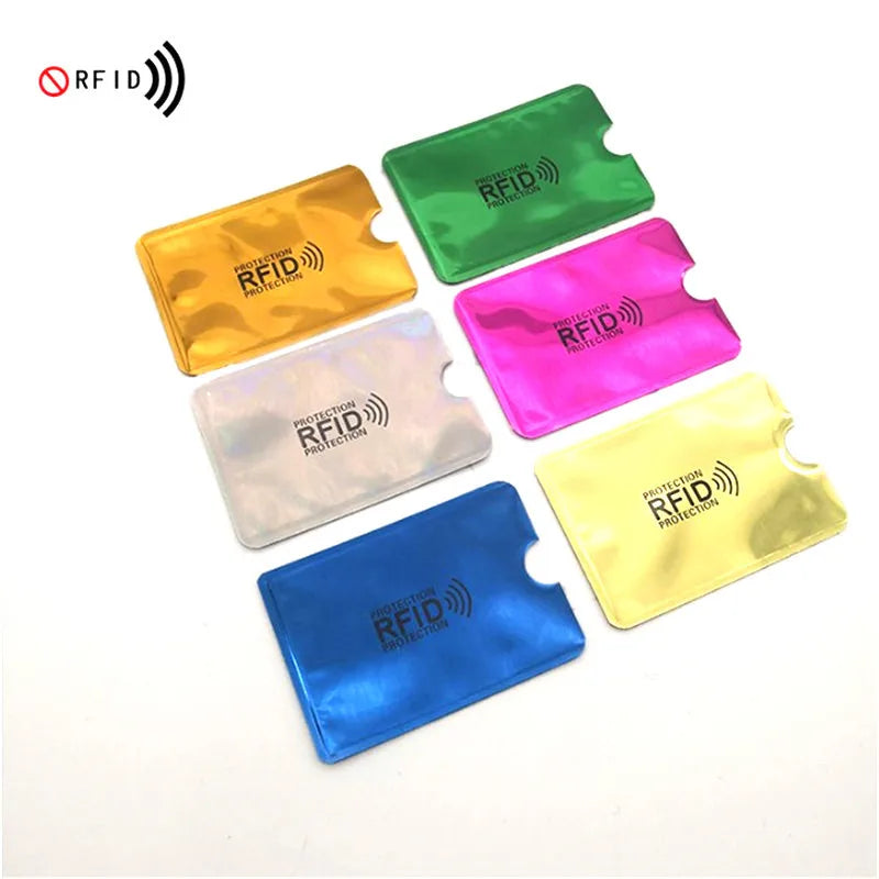 A collection of colorful RFID blocking aluminum card holders in green, yellow, pink, and blue.