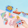 A colorful kit of animal origami crafts including a pink rabbit, a yellow bird, and blue creatures.