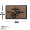 A rectangular embroidered tactical patch featuring an eagle design and the text US M.C.