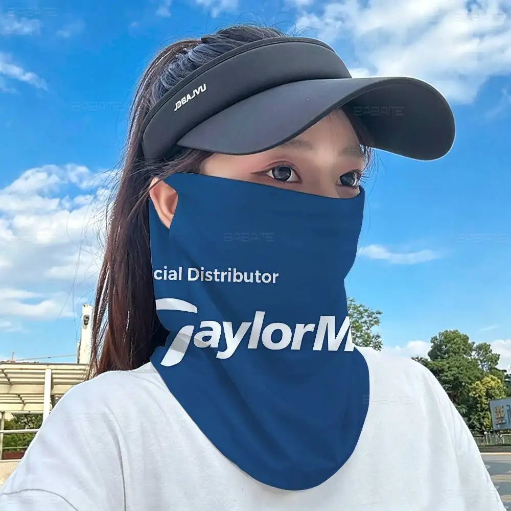 A person wearing a navy blue multifunctional neck gaiter and a dark baseball cap against a bright blue sky.