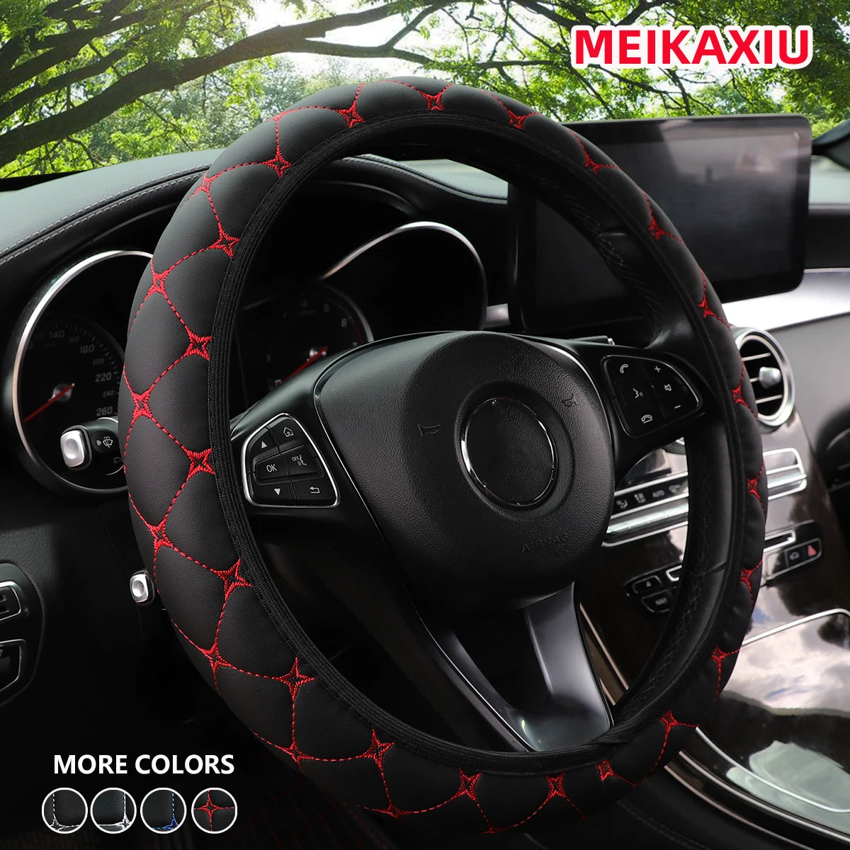 Close-up of a black steering wheel with red embroidered leather stitching inside a car interior.