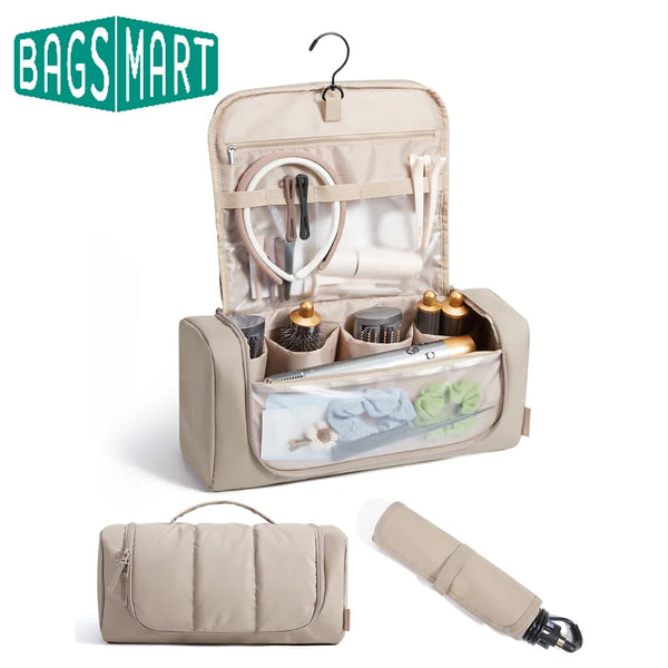 A beige travel hair tool organizer featuring a hanging hook and storage compartments for various tools.