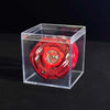 A red Valkyrie Volt S4-70V metal spinning top with launcher displayed inside a clear plastic box.