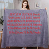 A purple microfiber bath towel is displayed flat, showing various size options written on the fabric.