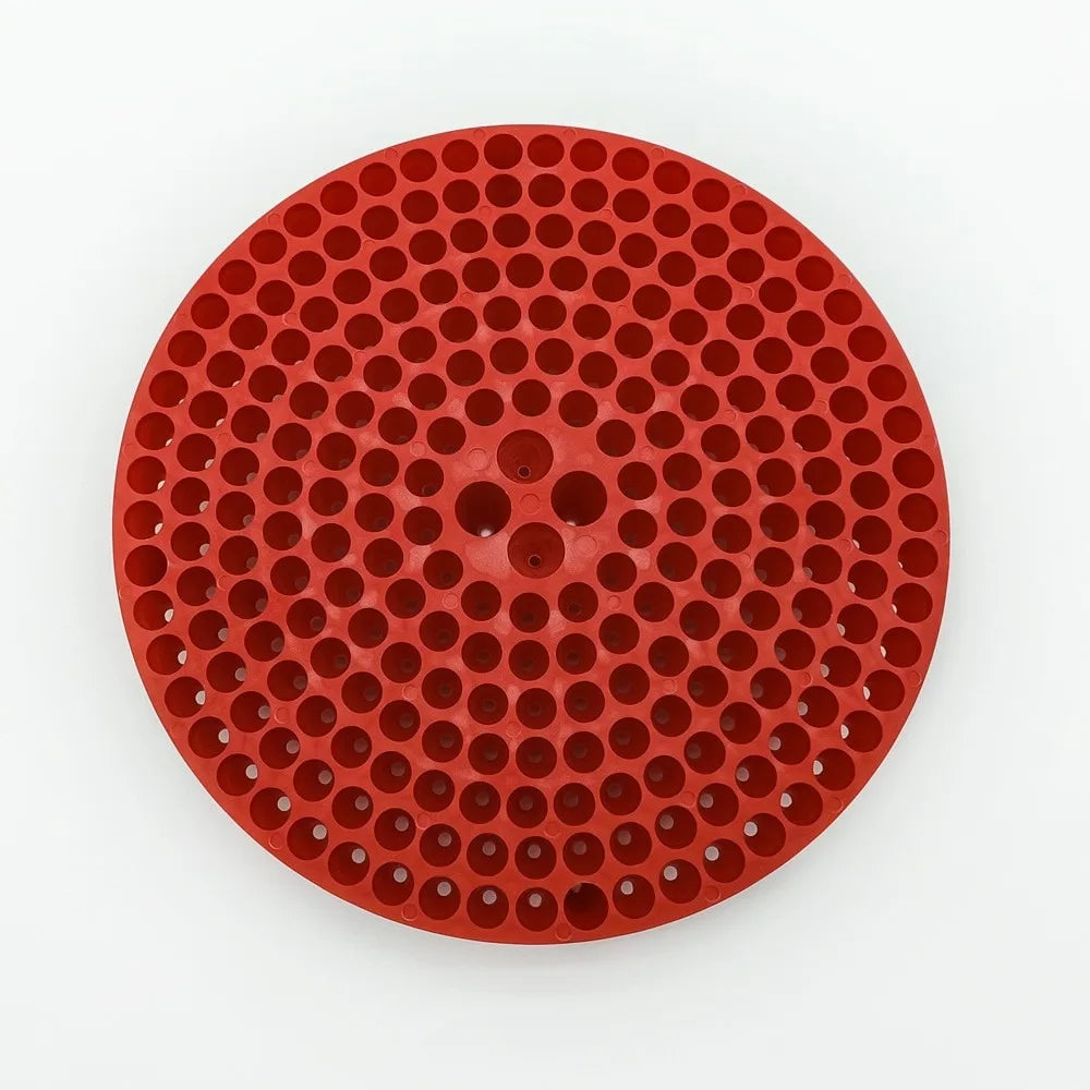 A round, red mesh insert for a car wash bucket grit guard.