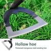 A close-up of a hollow hoe made of thickened manganese steel lying on green grass.