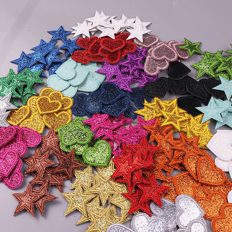 A colorful set of iron-on embroidered patches featuring various glitter hearts and stars in multiple colors.