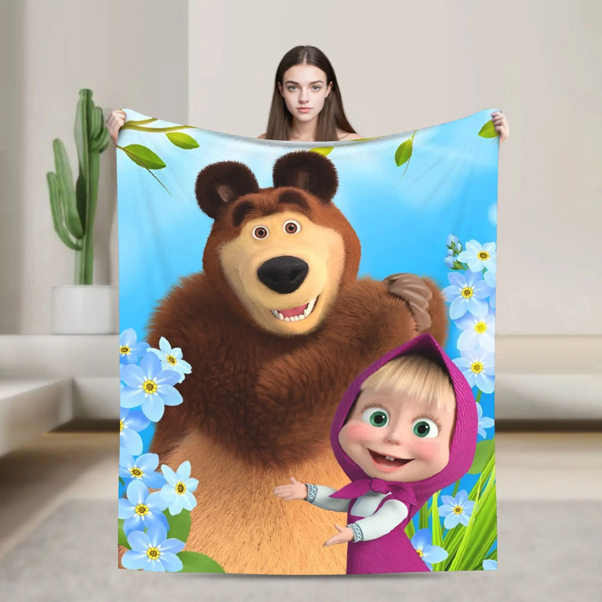 Flannel throw blanket featuring a cartoon design of a bear and a baby