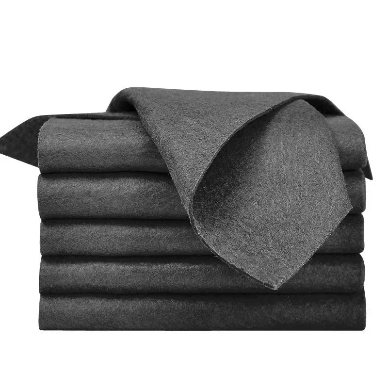 A stack of dark gray microfiber cleaning cloths folded neatly.